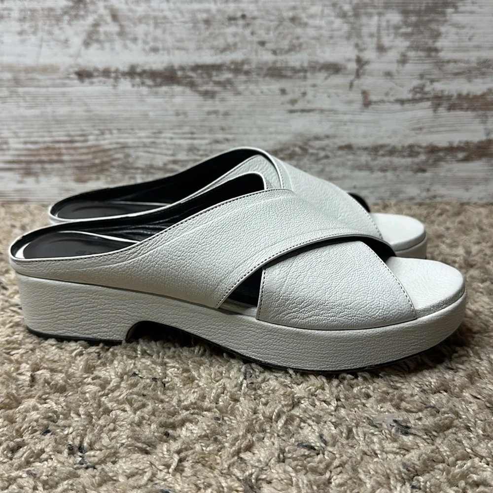 By Far Iggy Mules cross-front platform sandals in white leather